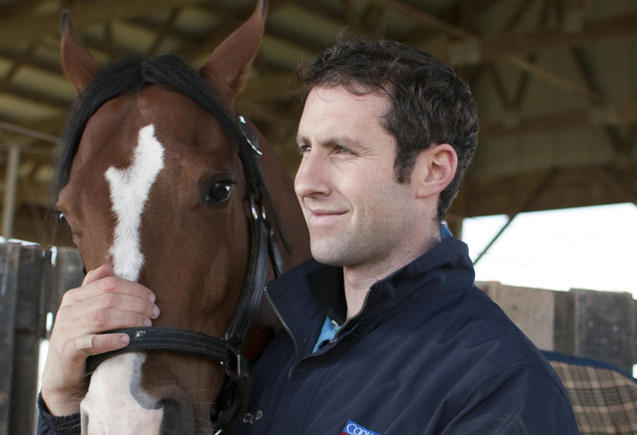 Conor Murphy, who trains horses for some of the most prominent figures in racing, with his horse, Bronterre, at the Skyline Training Center in Goshen, Ky., April 25, 2013. When Murphy was a stablehand in England, he made a life-changing bet on five of his favorite horses and won $1.5 million, enough to put down the shovel and become his own boss. (Jonathan Palmer/The New York Times)
