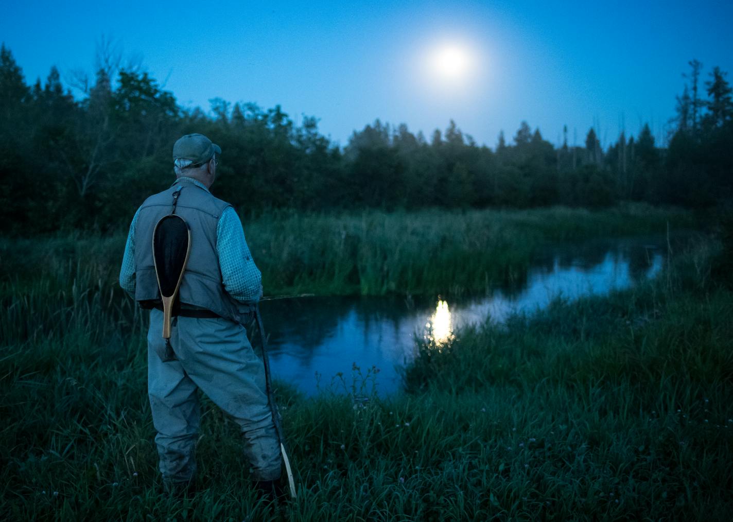 John Sorenson watched for disturbances on the water of the Straight River while fishing for brook trout in mid August. ] (AARON LAVINSKY/STAR TRIBUNE) aaron.lavinsky@startribune.com RIVERS PROJECT: We look at three of Minnesota's rivers, including the Mississippi, Red and Chippewa, to see how land use effects water quality and pollution.