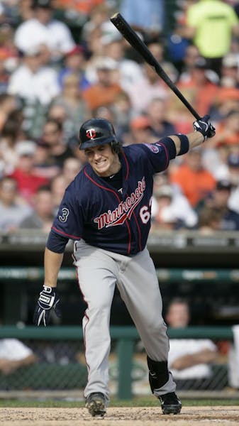 Minnesota Twins' Joe Benson reacts after striking out swinging against Detroit Tigers' Max Scherzer in the fourth inning of a baseball game, Saturday,