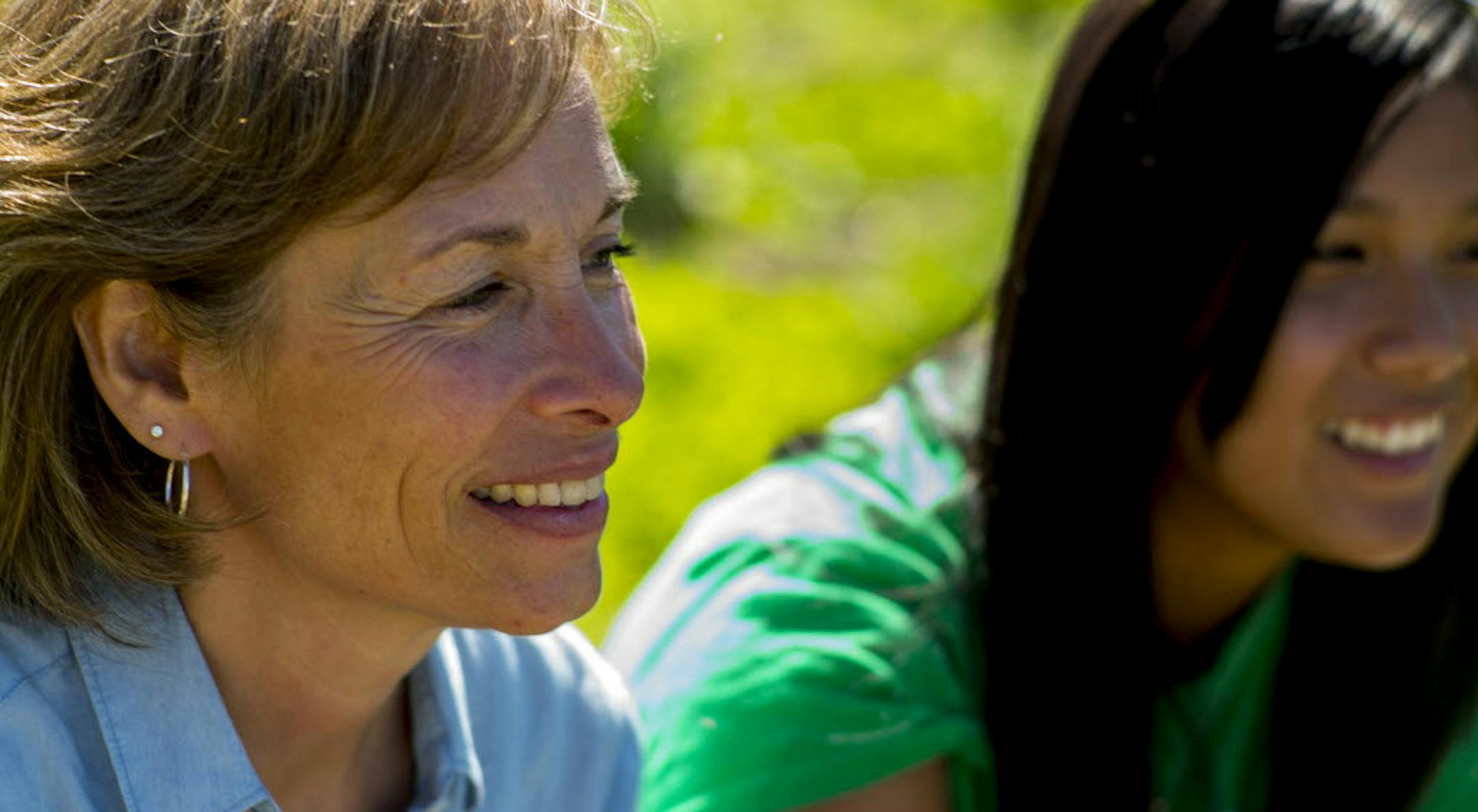 Susan Moores, founder of Roots for the Home Team, and veteran gardener Mela Nguyen,16, at a north Minneapolis garden. Rtsong-taatarii@startribune.com