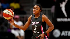 The new documentary "Power of the Dream" tells the story of WNBA players, including Atlanta Dream guard Renee Montgomery, who left the WNBA to be a fu