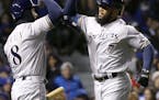 Brewers slugger Eric Thames, right, currently the top hitter in baseball with a .370 average entering the weekend &#x2014; appears to remain unfazed b