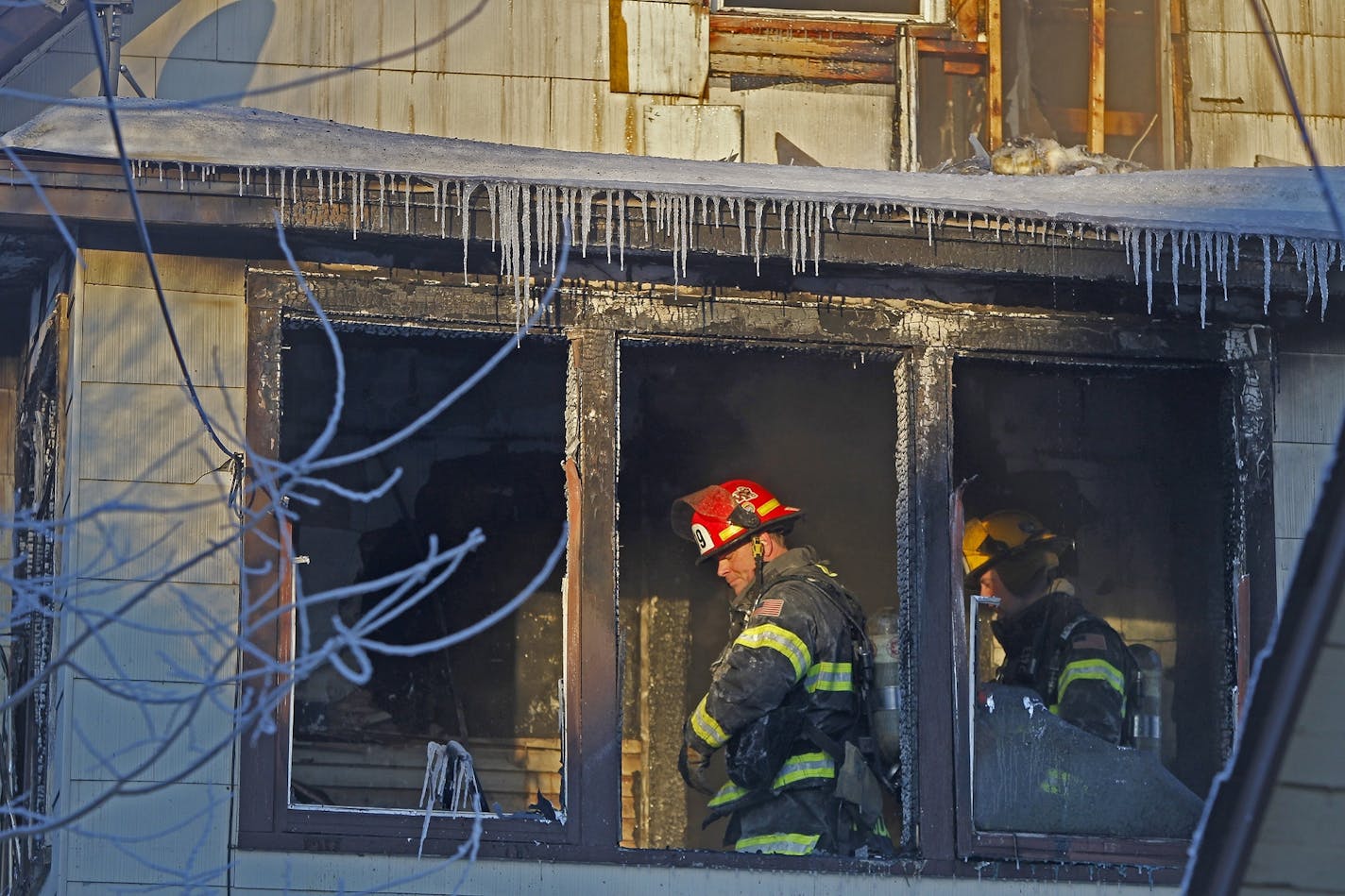 Minneapolis firefighters worked the scene where a fire broke out early Friday, February 14, 2014 on the 2800 block of Colfax Ave. N. in Minneapolis.