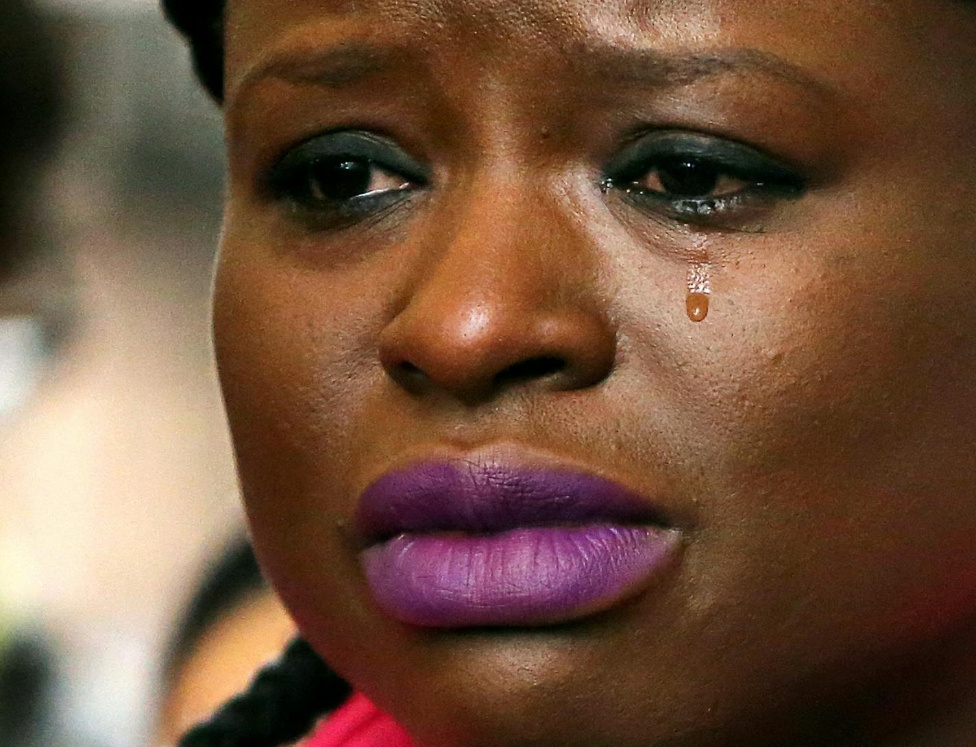 Minneapolis NAACP president Nekima Levy-Pounds wiped tears from her eyes as Pastor Carmen Means consoled her during a press conference. No charges were filed against the police in the shooting death Jamar Clark. At the Hennepin County Government Center Wednesday March 30, 2016 in Minneapolis, MN.] Minneapolis citizens react the Hennepin County Attorney Mike Freeman decision not to charge two Minneapolis officers with murder in the shooting of Jamar Clark. Jerry Holt/Jerry.Holt@Startribune.com