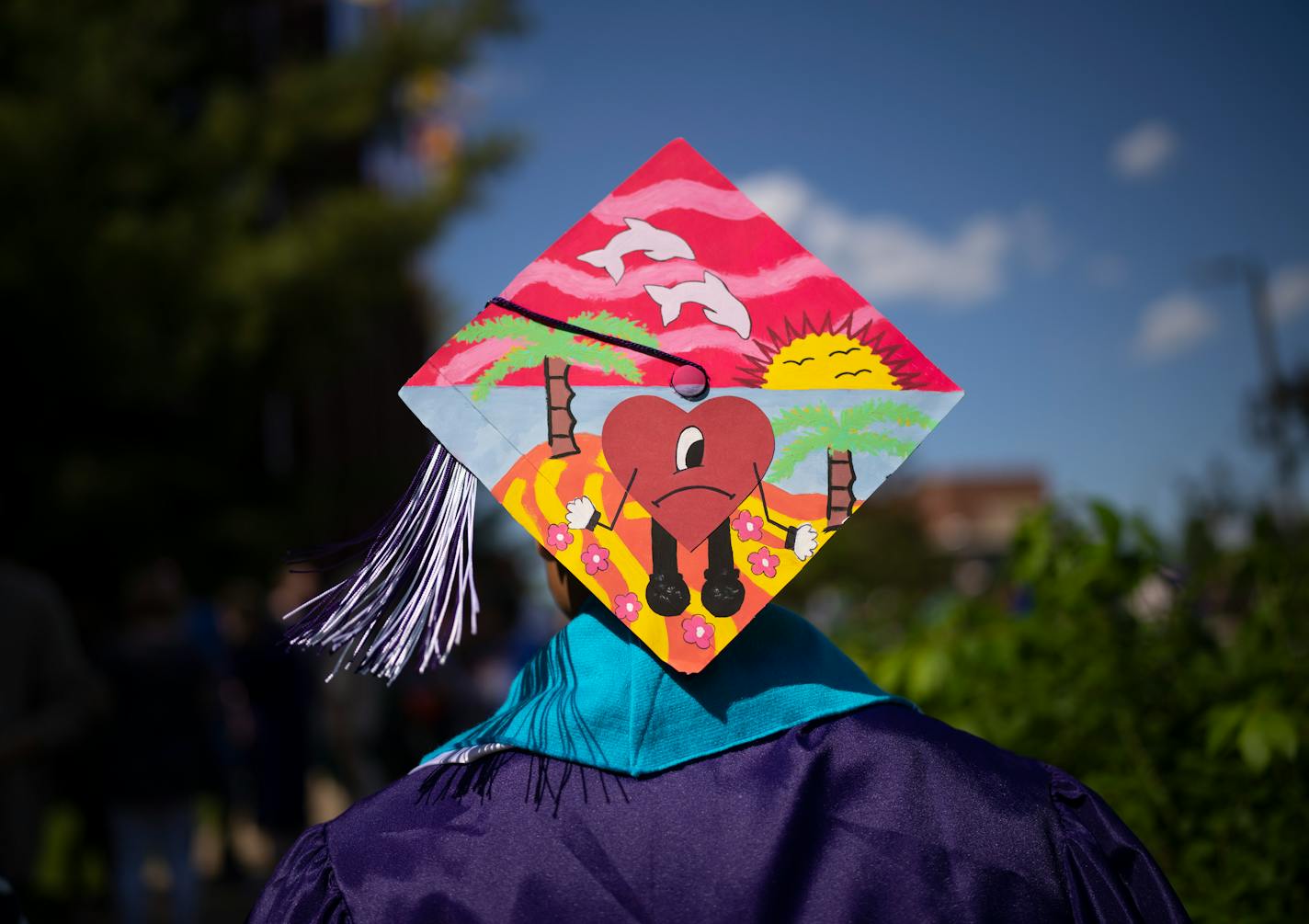 A Southwest grad outside 3M Arena at Mariucci after his commencement ceremony ended and before South High School's began last June.