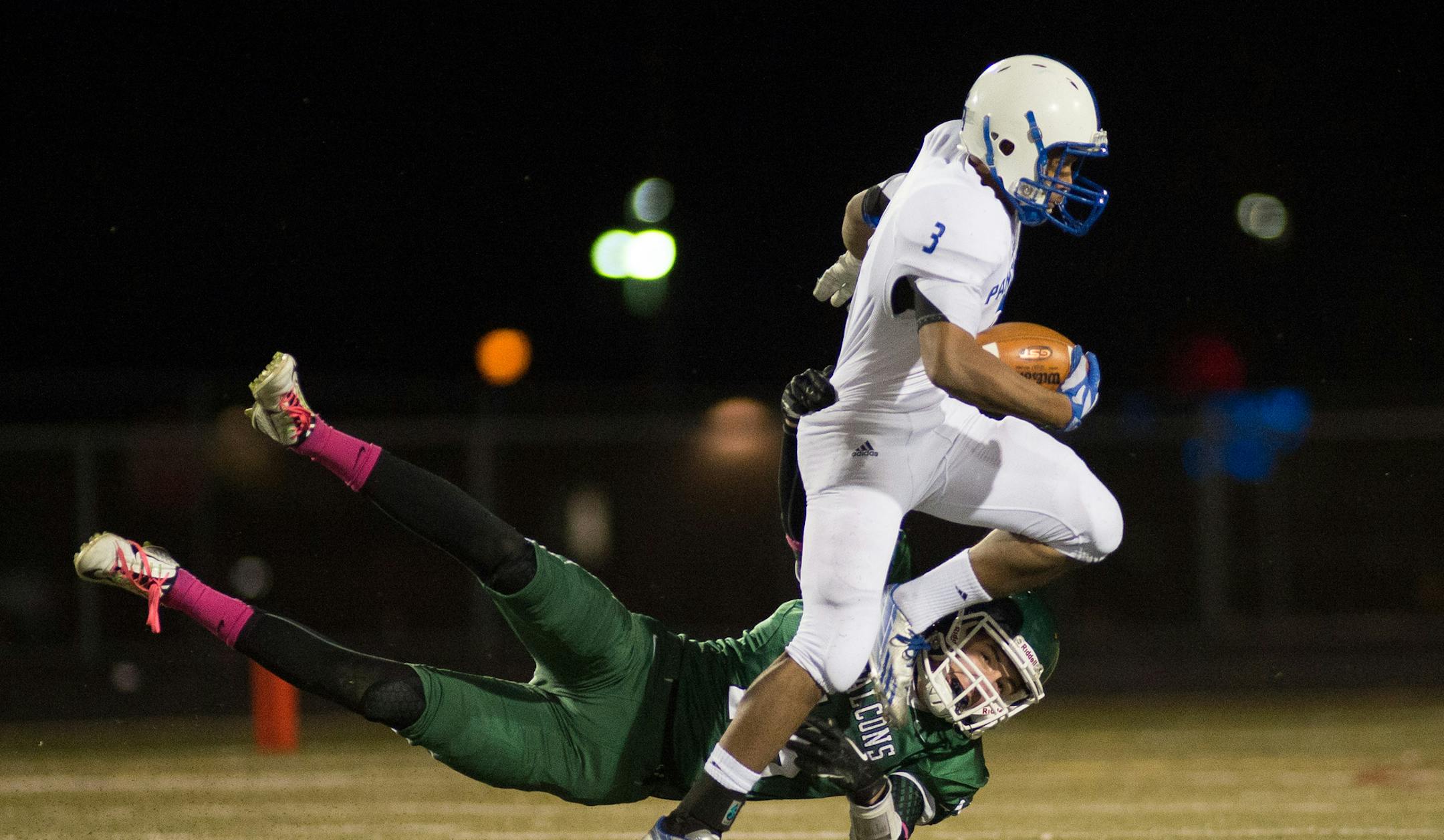 Spring Lake Park running back Isley Carrington (3) breaks a tackle by Faribault safety Cole Miller (15) during the first quarter of Saturday night's game. ] AARON LAVINSKY • aaron.lavinsky@startribune.com Spring Lake Park plays Faribault in the Class 5A State Quarterfinals Saturday night at Lakeville North High School.