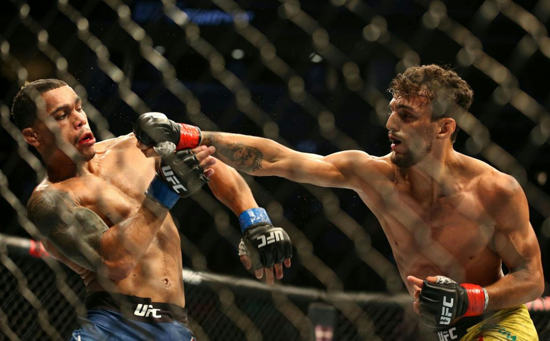 Journey Newsome dodges a punch from Ricardo Ramos in the second round. Ramos would go on to win the match. ALEX KORMANN ¥ alex.kormann@startribune.com UFC Fight Night was held at Target Center on Saturday June 29, 2019. Francis Ngannou and Junior Dos Santos headlined the event.