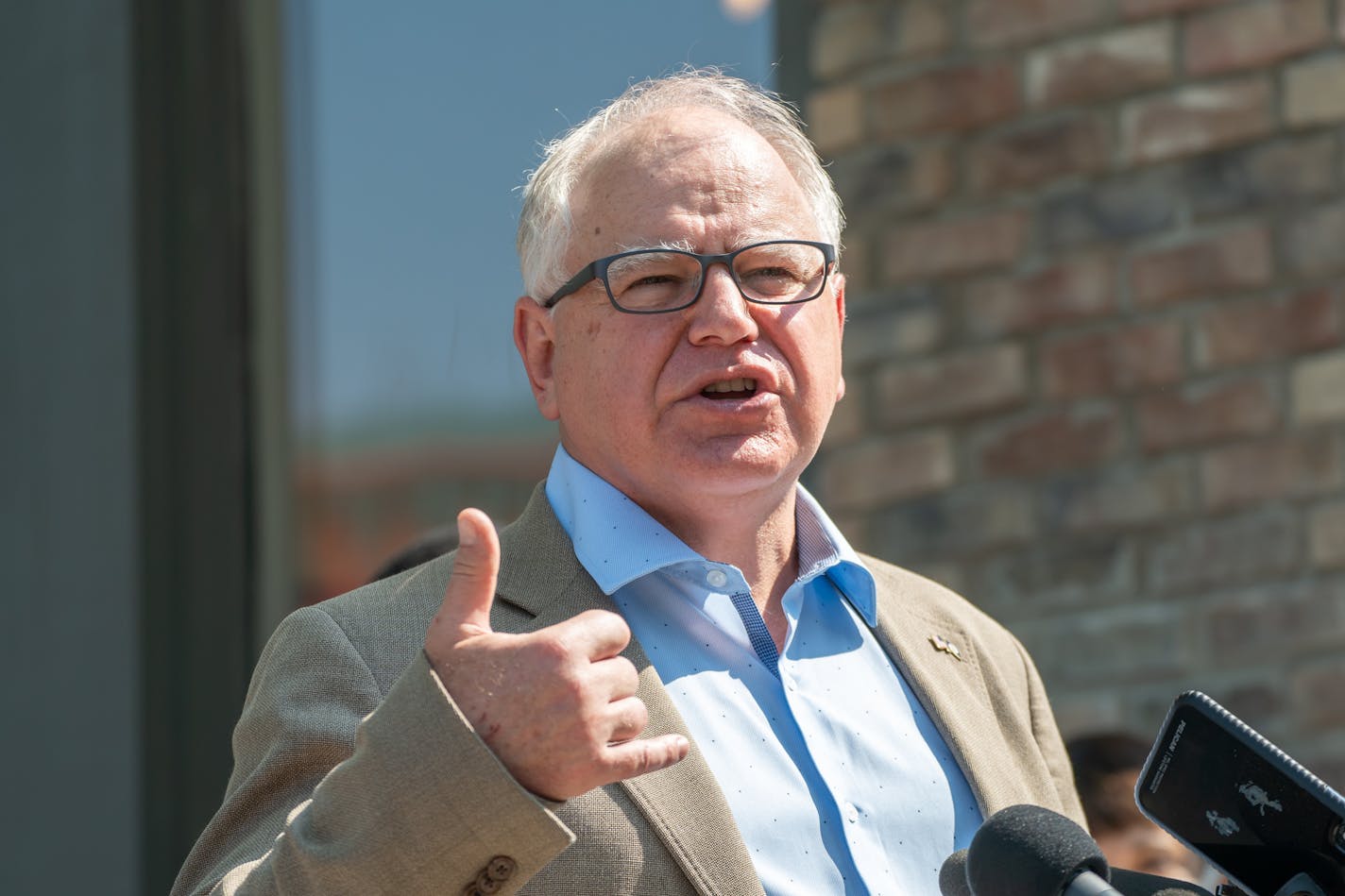 Minnesota state officials on Friday said the state formally applied for the federal government's new $300/week benefit for people left unemployed by the pandemic. File photo of Gov. Tim Walz at a St. Paul business on Thursday.