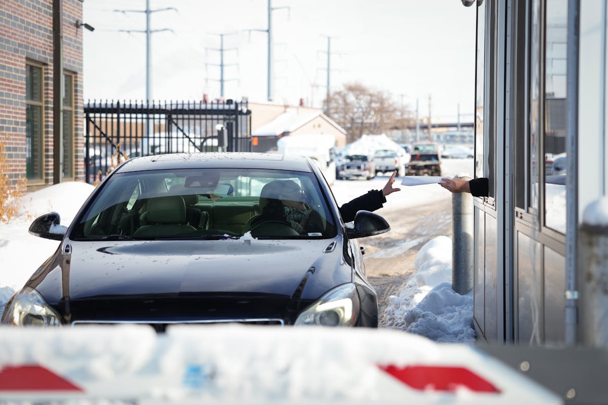 Tammy Dahl exits the impound lot in Minneapolis, Minn., on Thursday, Jan. 5, 2023. Dahl, who lives in St. Paul, was visiting a friend when her car was