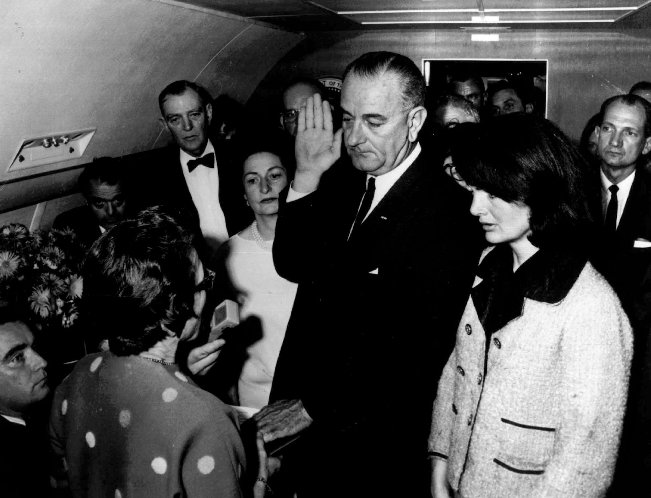 *** FILE *** Lyndon B. Johnson is sworn in as President of the United States of America in the cabin of the presidential plane as Mrs. Jacqueline Kennedy stands at his side in this Nov. 22,1963 file photo. Cecil Stoughton, the White House photographer who shot the iconic image of Lyndon B. Johnson taking the oath of office aboard Air Force One, has died. He was 88. Stoughton died Monday Nov. 3, 2008 evening at his Florida home, his son Jamie Stoughton said Tuesday. Judge Sarah T. Hughes, a Kenne