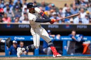 Minnesota Twins designated hitter Byron Buxton (25) swings at a pitch against the Los Angeles Dodgers in the fifth inning at Target Field in Minneapol