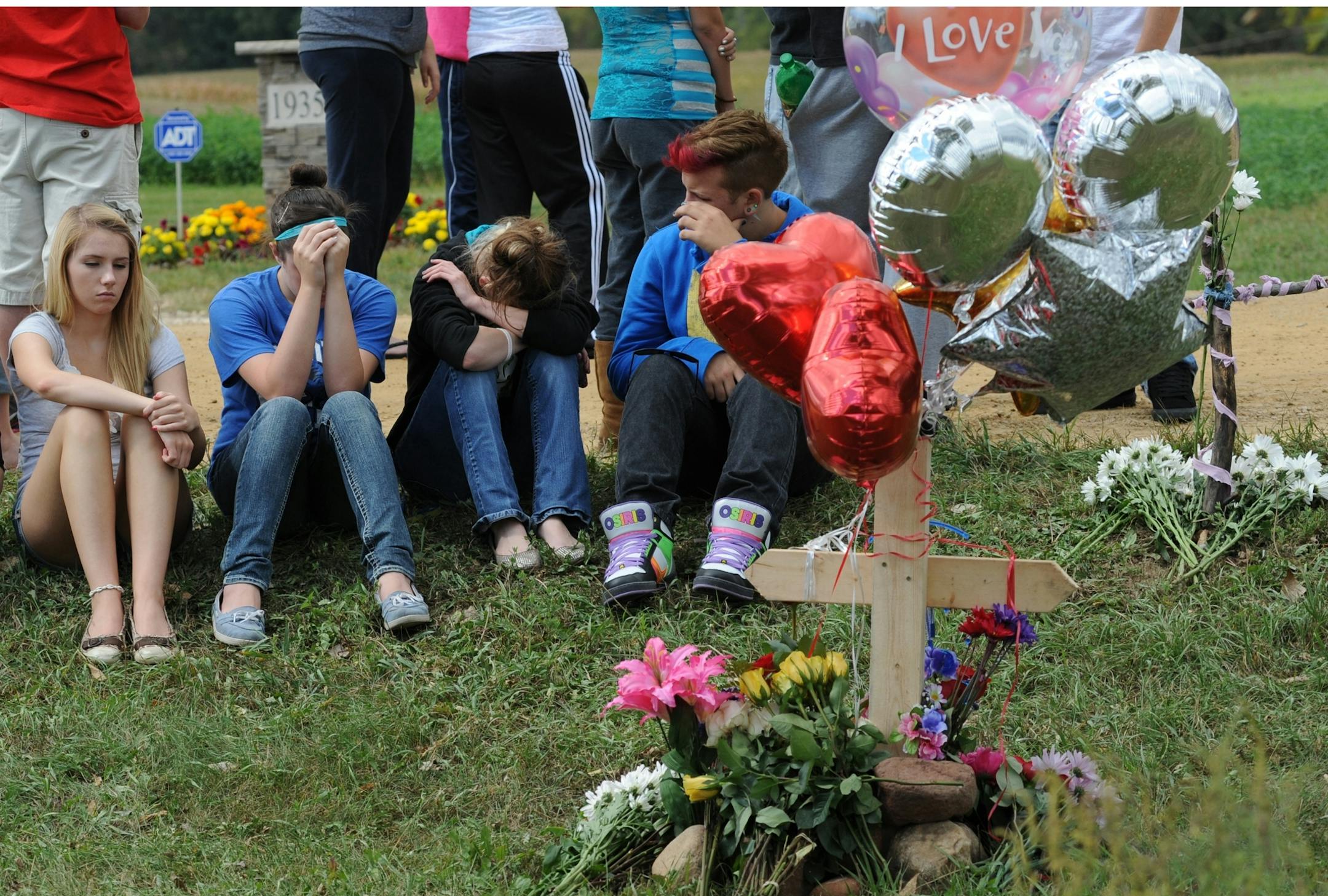 A car and a pickup truck collided on a gravel road south of Hastings, killing high school student Maddy R. Sake, 16, and injuring three young people, authorities and the Hastings School District said Friday. Friends and class mates grieved at the crash site by a memorial for their friend Maddy Sake