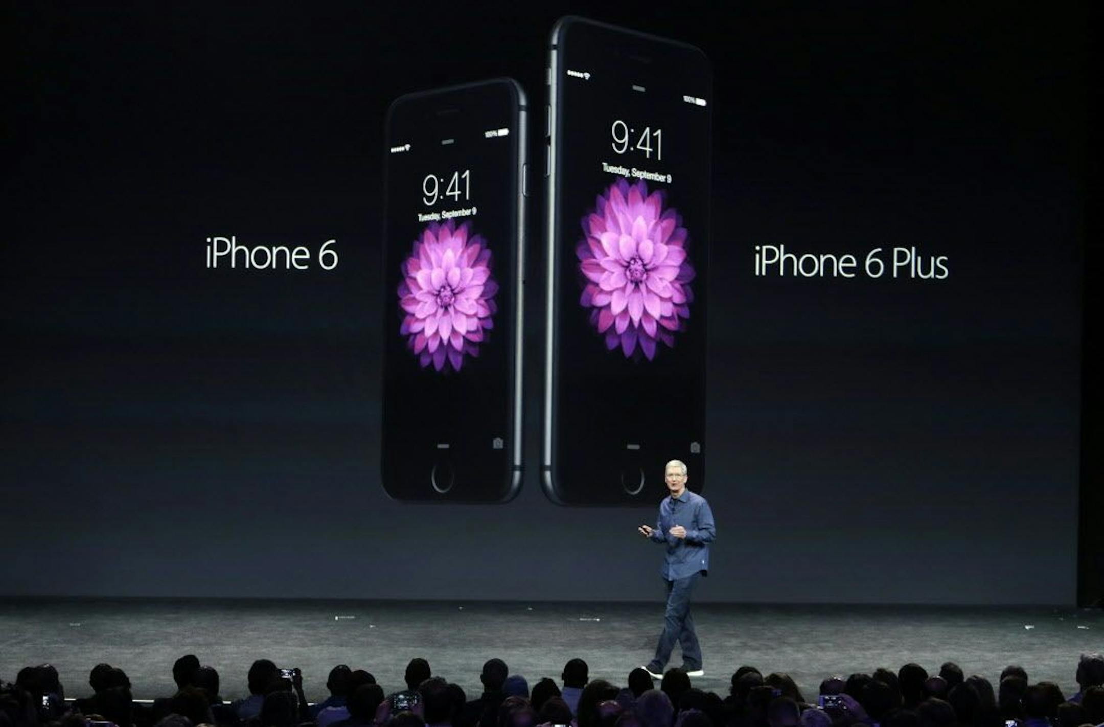 Apple CEO Tim Cook introduces the new iPhone 6 and iPhone 6 Plus on Tuesday, Sept. 9, 2014, in Cupertino, Calif.
