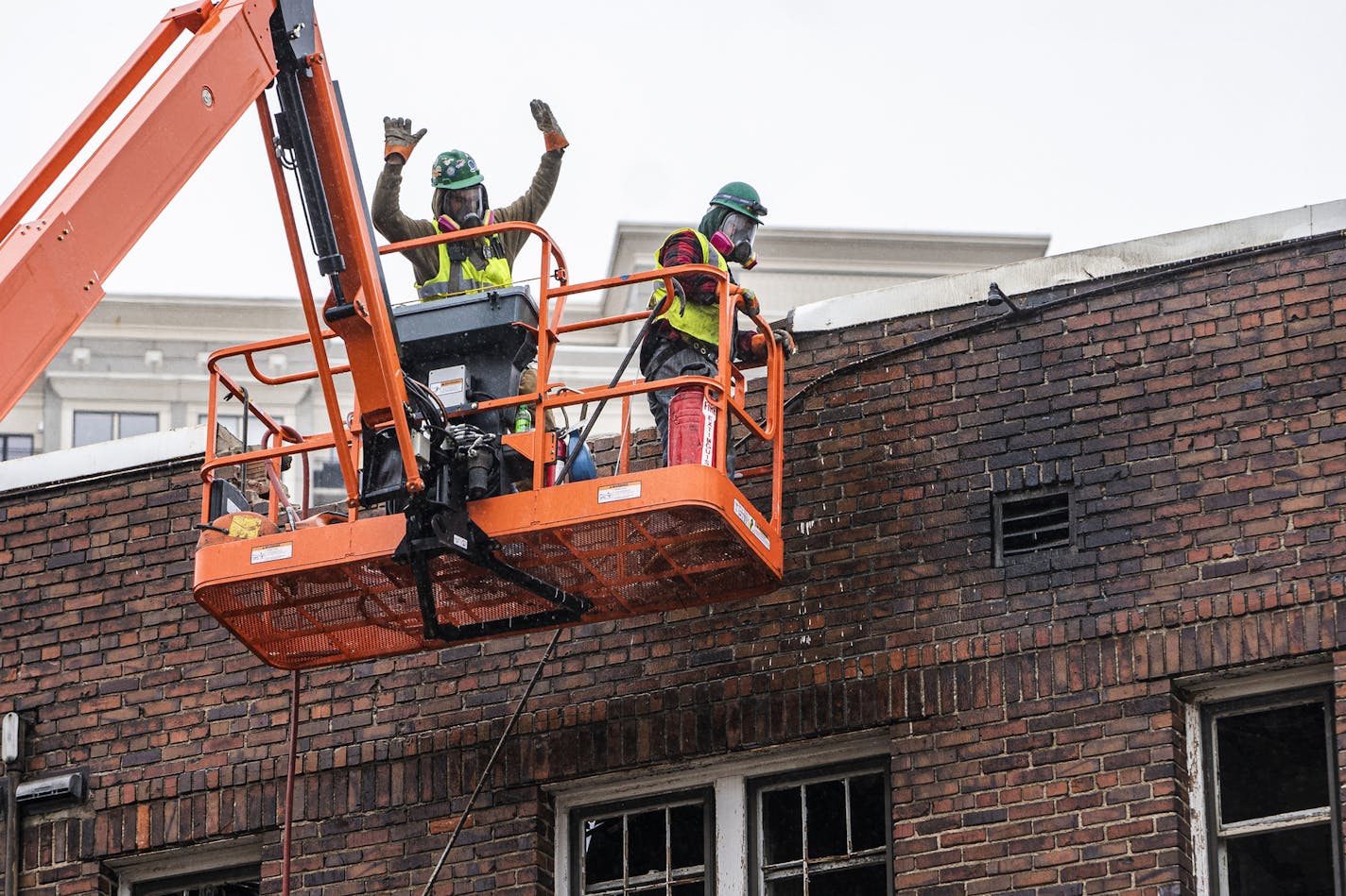 Careful demolition of the Francis Drake Hotel has begun in Minneapolis. Crew members used hazmat masks because of residue toxic fumes.