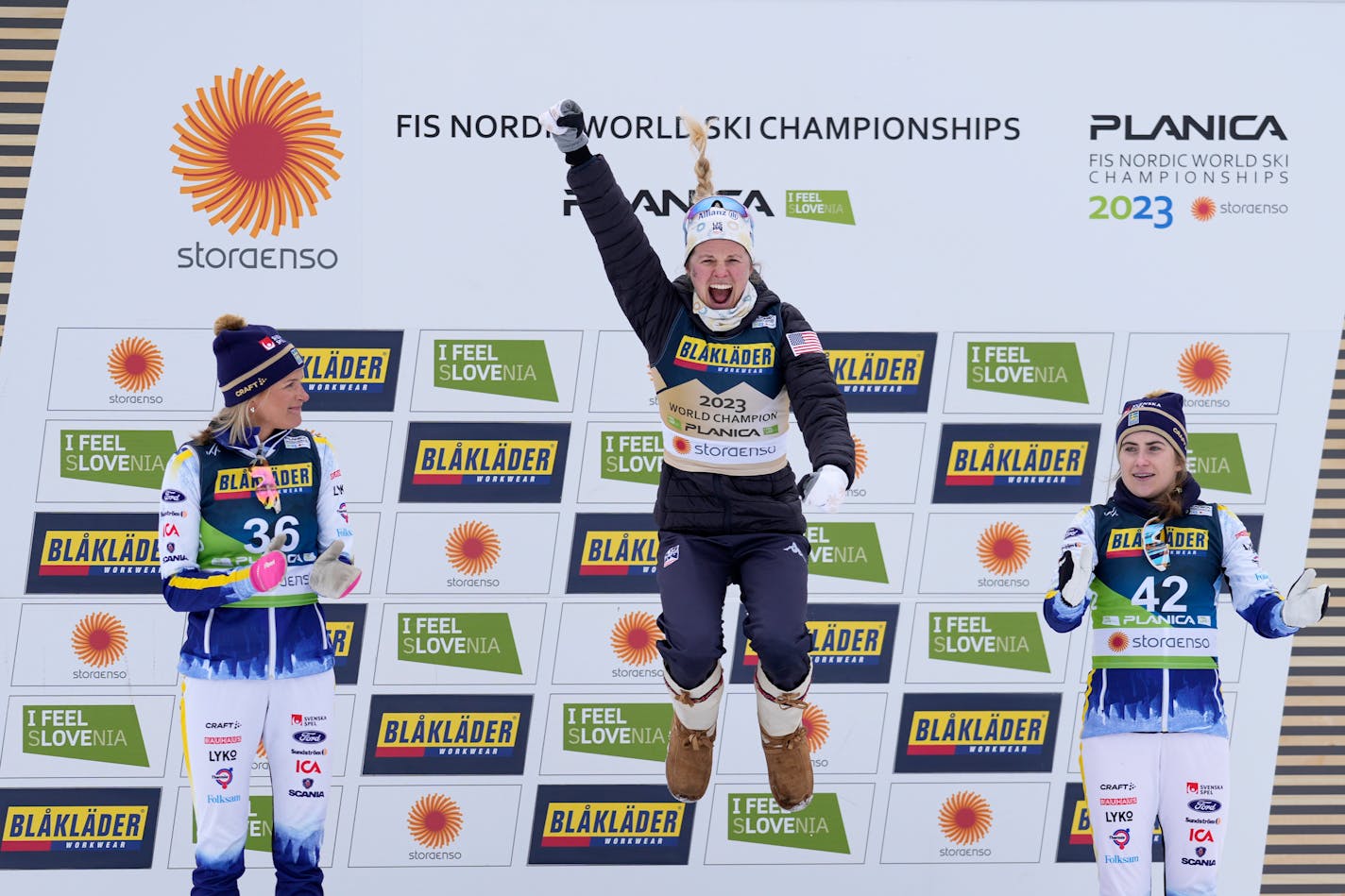 Jessie Diggins celebrates on the podium after winning the Women's Cross Country Interval Start 10 KM Free event at the Nordic World Championships in Planica, Slovenia on Tuesday,