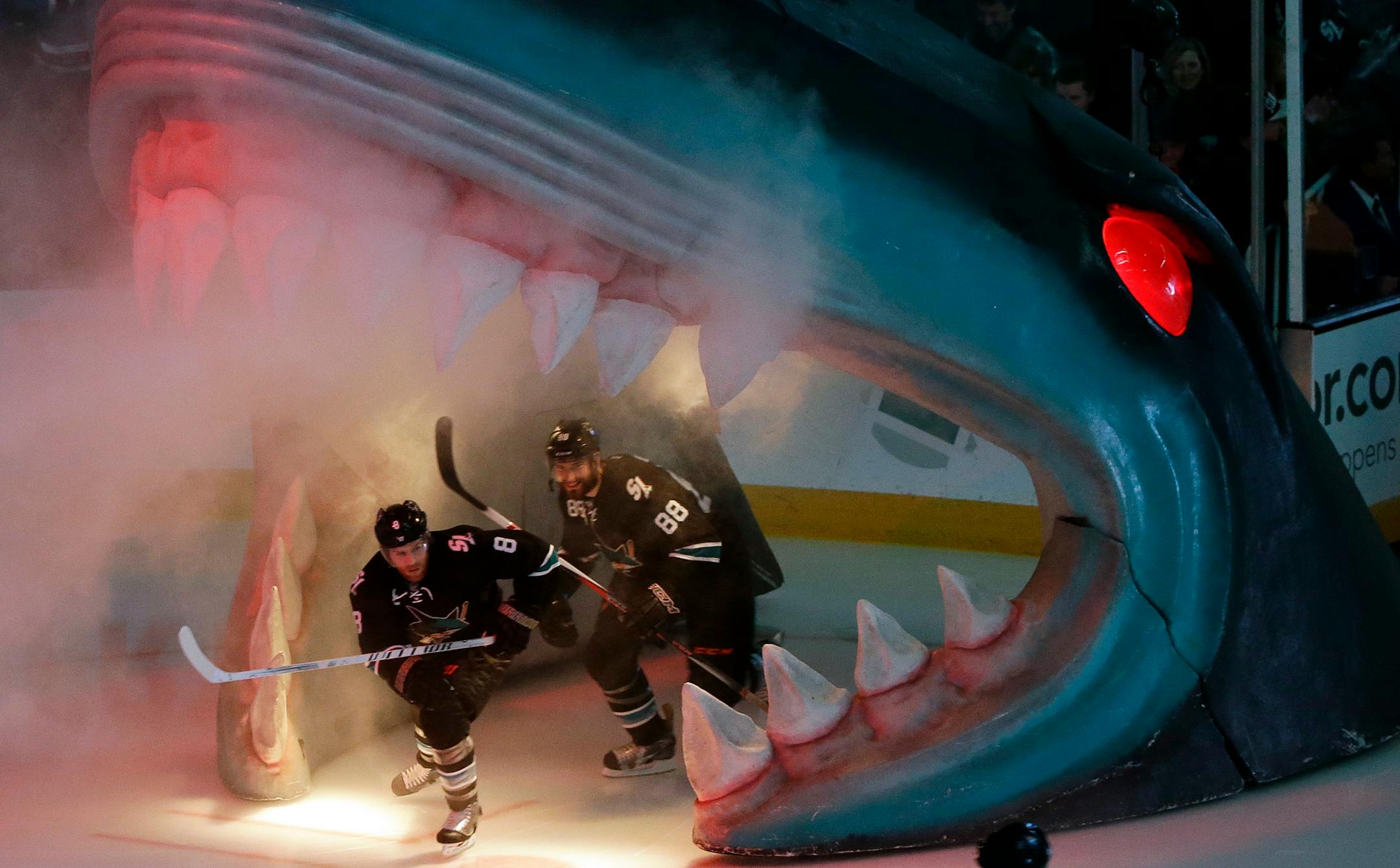 San Jose Sharks' Joe Pavelski (8) and Brent Burns (88) are introduced during an NHL hockey game against the Winnipeg Jets on Thursday, Jan. 23, 2014, in San Jose, Calif. (AP Photo/Marcio Jose Sanchez)