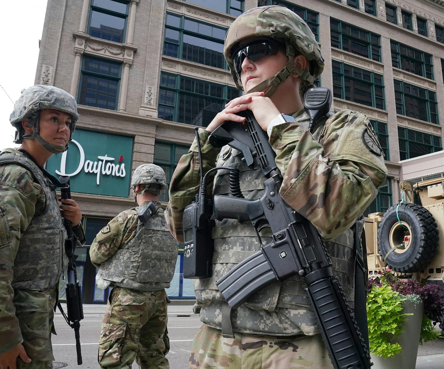 Members of the Minnesota National Guard stood at the intersection of South 7th Street and Nicollet Mall Thursday as community members and business owners cleaned up the damaged there caused by a group of looters Wednesday night after the suicide of a homicide suspect on the Mall ignited rioting. ] ANTHONY SOUFFLE • anthony.souffle@startribune.com Community members and business owners cleaned up the damaged on Nicollet Mall caused by a group of looters Wednesday night after the suicide of a homic