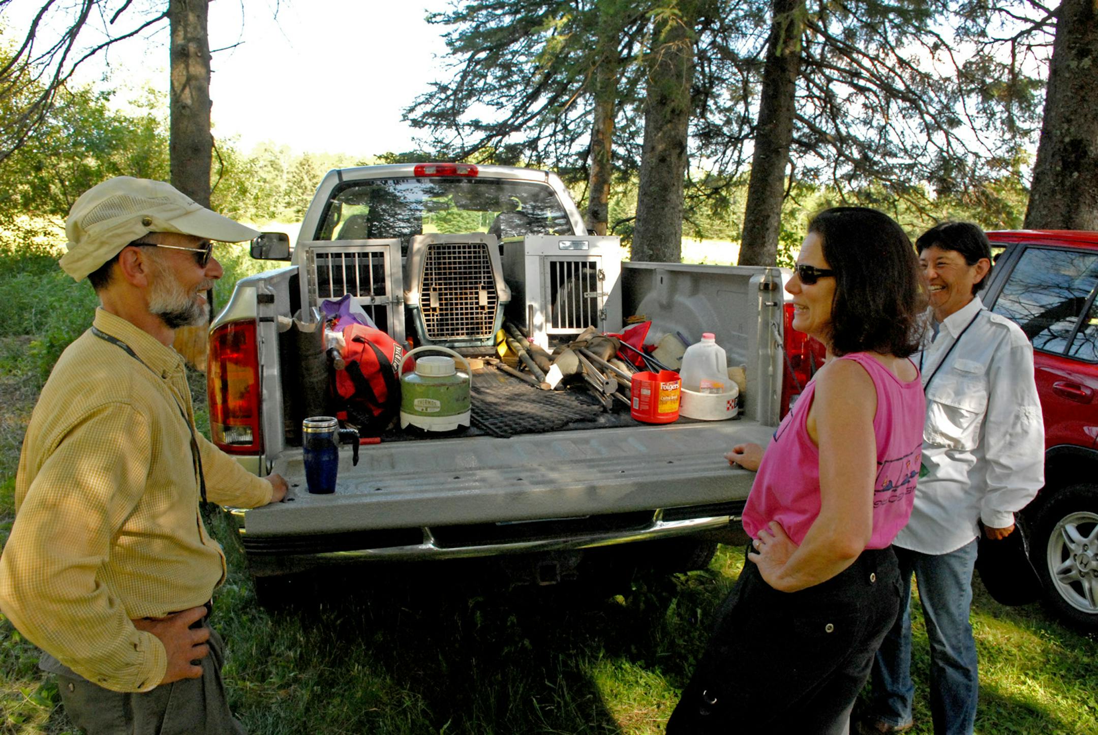 Retriever training in the end is a social undertaking. Two, three and often times four handlers are needed to set up land and water retrieving tests. Here, Tom Fait of Duluth and Duluth Retriever Club president Kim Keelor, foreground, spend many hours training their Labradors and volunteering at the club. At right is Jean Wu, from Arizona, who was training her Labs for a few days at the Duluth club.