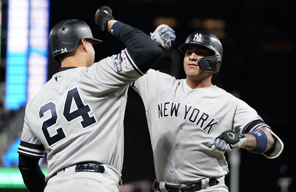 The Yankees' Gleyber Torres, right, celebrated with teammate Gary Sanchez after Torres belted a home run in the second inning of Game 3 on Monday nigh