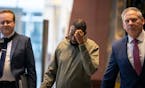 Defendant Said Shafii Farah, center, walks into United States District Court with attorneys Clayton Carlson, left, and Steve Schleicher, right, on Apr