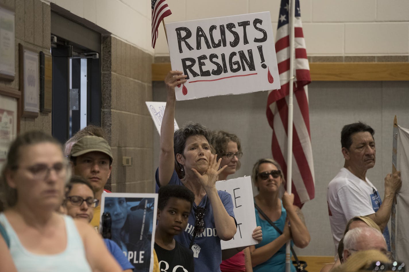 Residents of St. Anthony shouted for Mayor Jerry Faust and other council members to resign during a packed meeting . St. Anthony City Council pass a resolution to terminate its police contract with Falcon Heights at during Tuesday night's meeting at City Hall July 11, in St. Anthony, MN. ] JERRY HOLT &#xef; jerry.holt@startribune.com