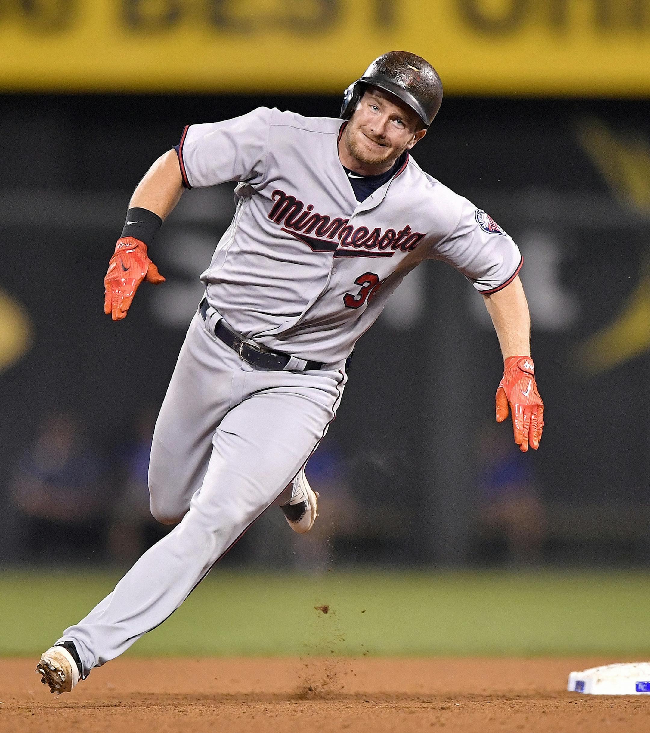 The Minnesota Twins' Robbie Grossman heads for third base with an RBI triple in the eighth inning against the Kansas City Royals at Kauffman Stadium in Kansas City, Mo., on Friday, Sept. 8, 2017. (John Sleezer/Kansas City Star/TNS) ORG XMIT: 1210710