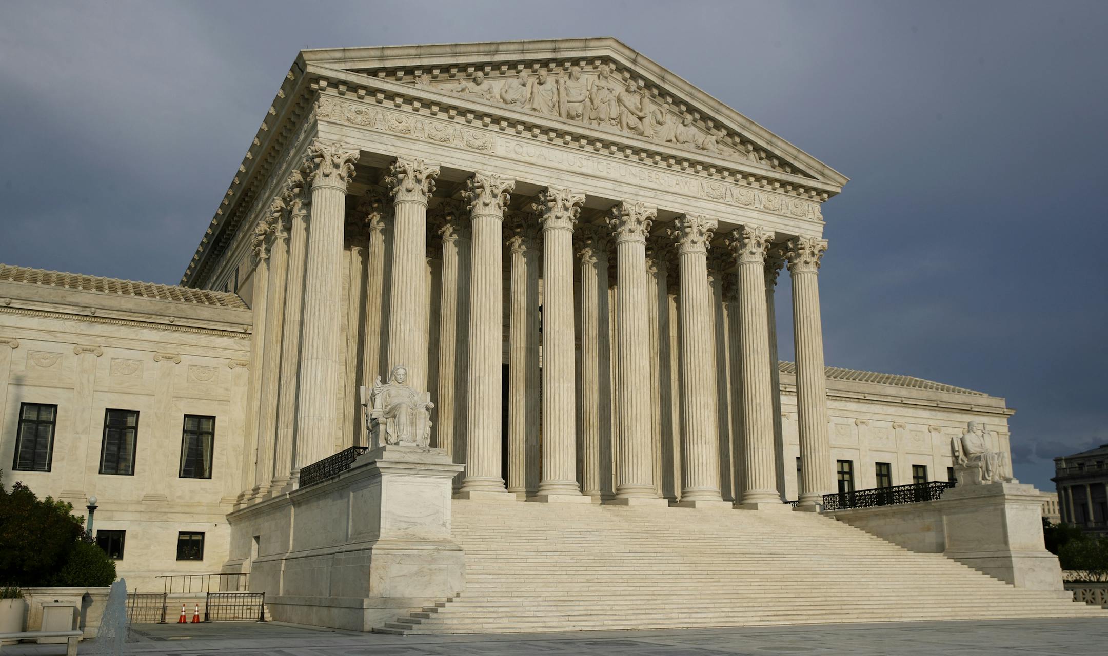 FILE - In this May 3, 2020, file photo the setting sun shines on the Supreme Court building on Capitol Hill in Washington. The Supreme Court opens a new term Monday, Oct. 5. (AP Photo/Patrick Semansky, File)