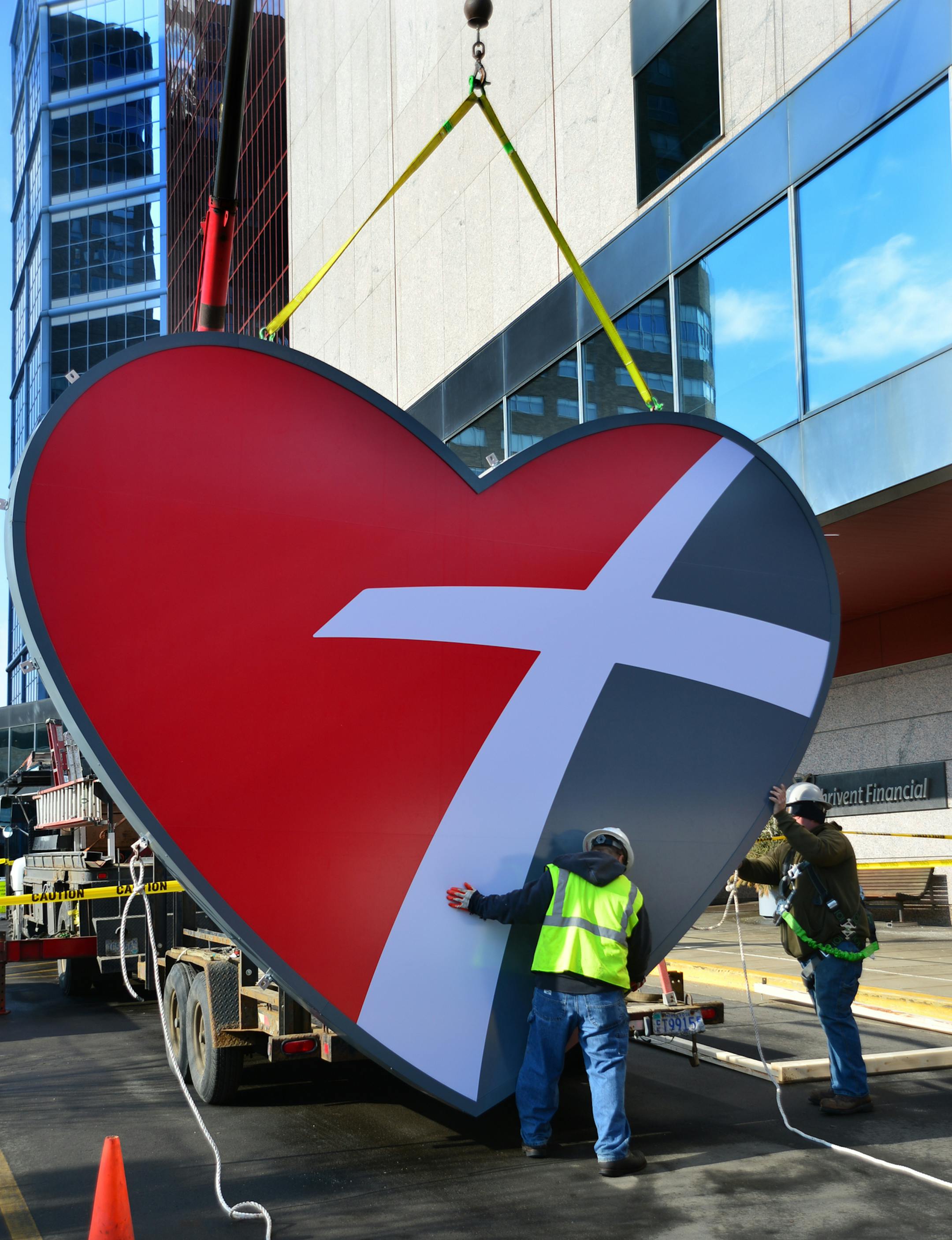 Workers started the process of installing the new heart emblem on their building in downtown Minneapolis, as part of the new branding campaign.. ] Thrivent brand changes beginning March 3, they are putting p a new large "heart" emblem on their building as part of the new branding campaign.. Thrivent has refreshed its brand to better express the story of the organization and to help more Christians feel welcome. This change is a natural next step following the membership vote to extend the common