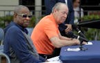 Houston Astros owner Jim Crane, right, and manager Dusty Baker listen to a question during a news conference on Thursday.