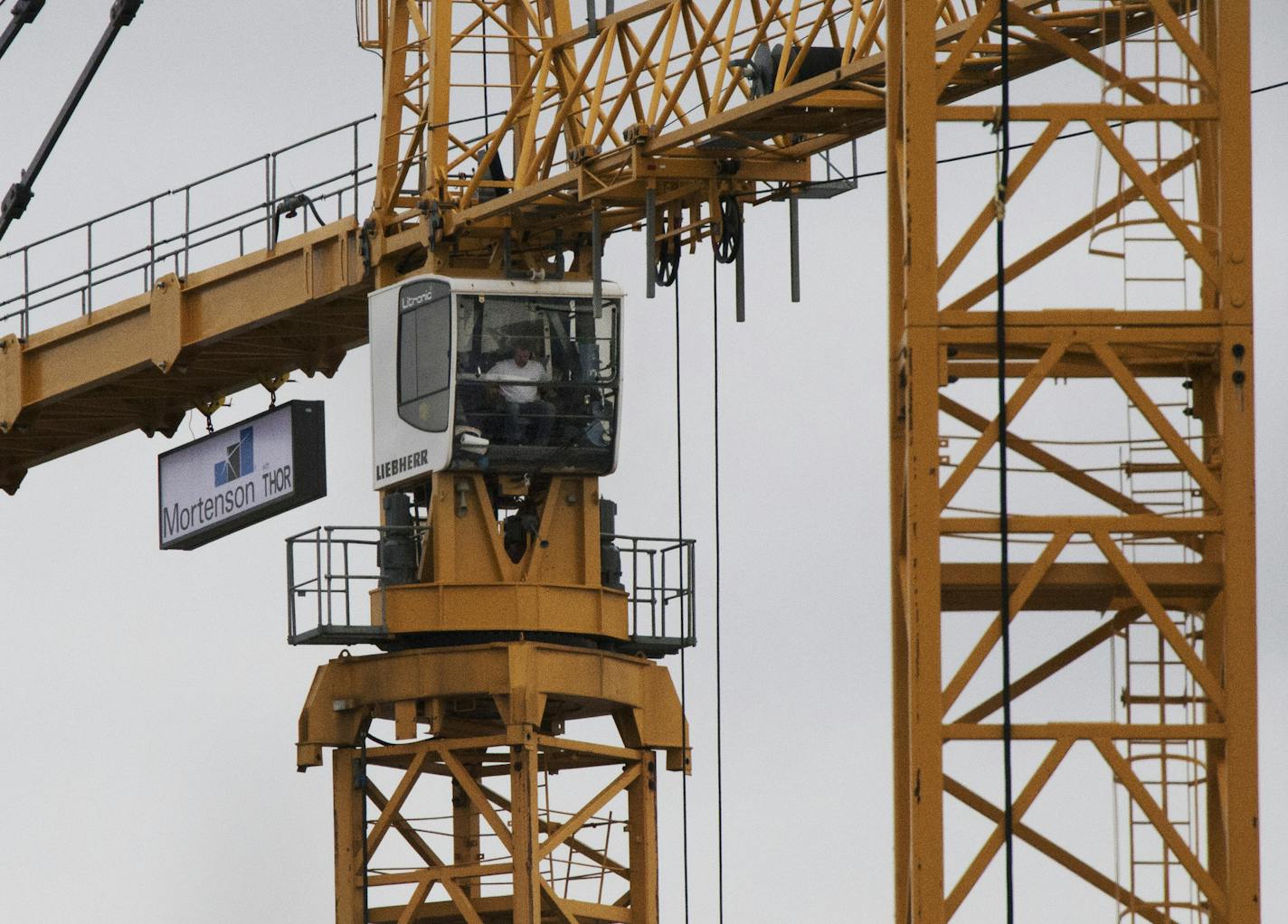 A crane on the new Viking stadium site lifting construction materials to where they are needed. ] Interview with two stadium crane operators. 961295 Crane_100414 20036502A (DAVID BREWSTER/STAR TRIBUNE)