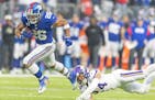 Giants running back Saquon Barkley scored a fourth-down touchdown against the Vikings in December. He has 1,650 yards from scrimmage this season.