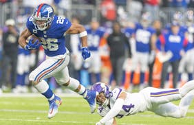 Giants running back Saquon Barkley scored a fourth-down touchdown against the Vikings in December. He has 1,650 yards from scrimmage this season.