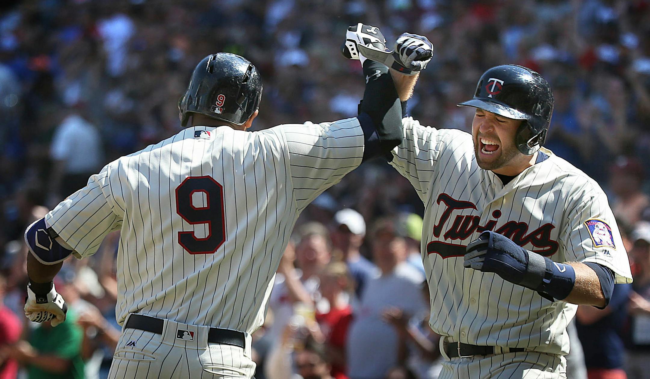 Minnesotaís Brian Dozier (right) celebrated with Eduardo Nunez in the eighth inning, after Nunez hit a three-run home run. ] JIM GEHRZ ï james.gehrz@startribune.com / Minneapolis, MN / May 21, 2016 1:10 PM ñ BACKGROUND INFORMATION: Twins vs Toronto at Target Field. The Twins won the game, 5-3.