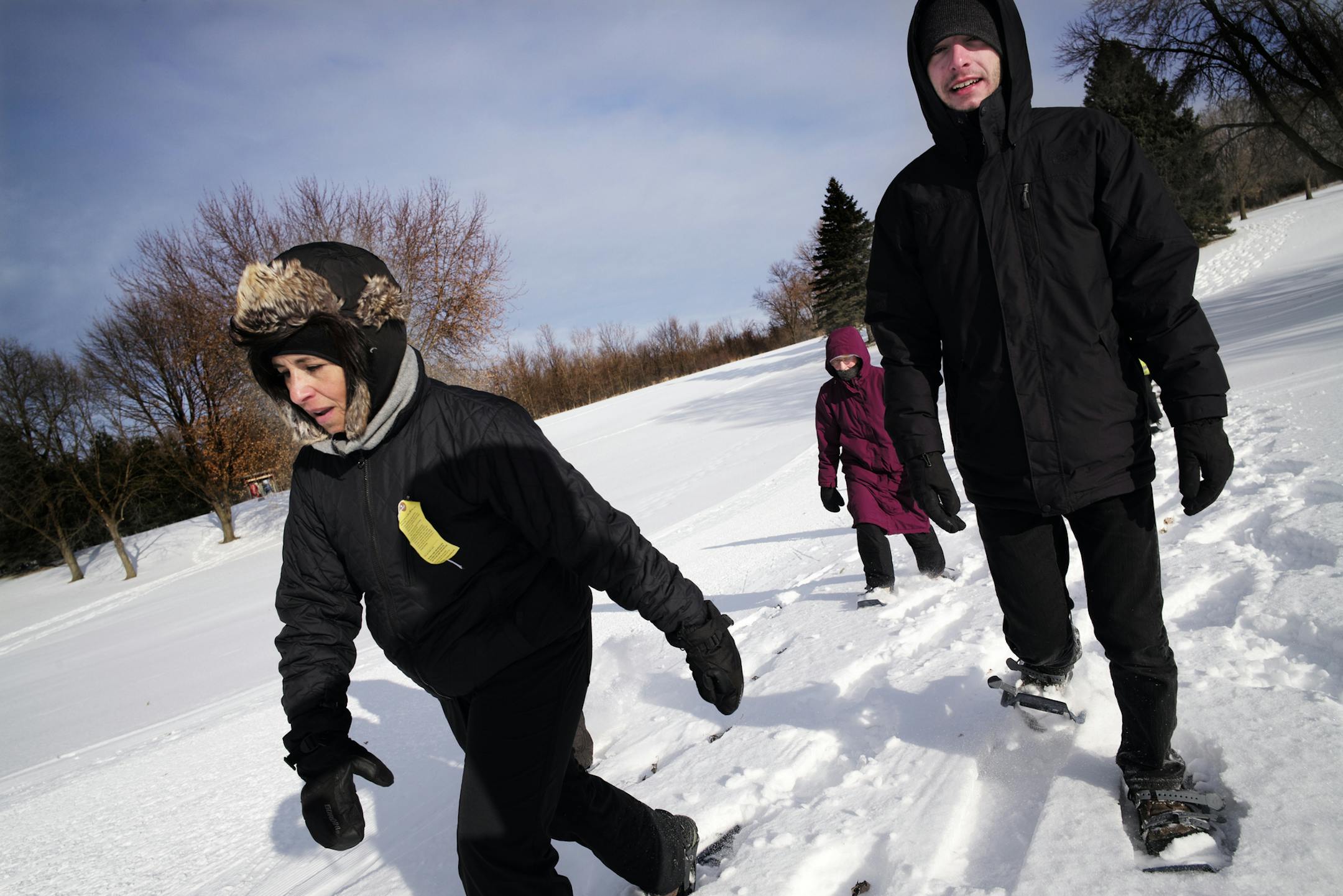 At Cleary Lake Regional Park in Prior Lake, snowshoers took a class and ventured unto a trail where temperatures hovered around zero degrees. Instructor Kim Woodin, far left, and volunteer Aaron Crenshaw were out front.]richard tsong-taatarii/rtsong-taatarii@startribune.com
