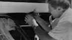 July 23, 1991 Rock Kills Driver -- Sgt. Terry Biddle of the Eau Claire Sheriff's Department collects evidence from a vehicle that was struck by a 35-f