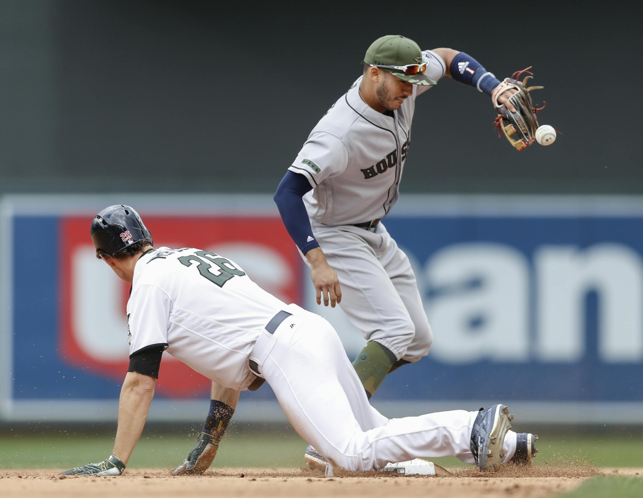 Minnesota's Max Kepler (26) slid safely into second against Houston's Carlos Correa after hitting a double in the fifth inning at Target Field in Minneapolis, Minn. on Monday, May 29, 2017.