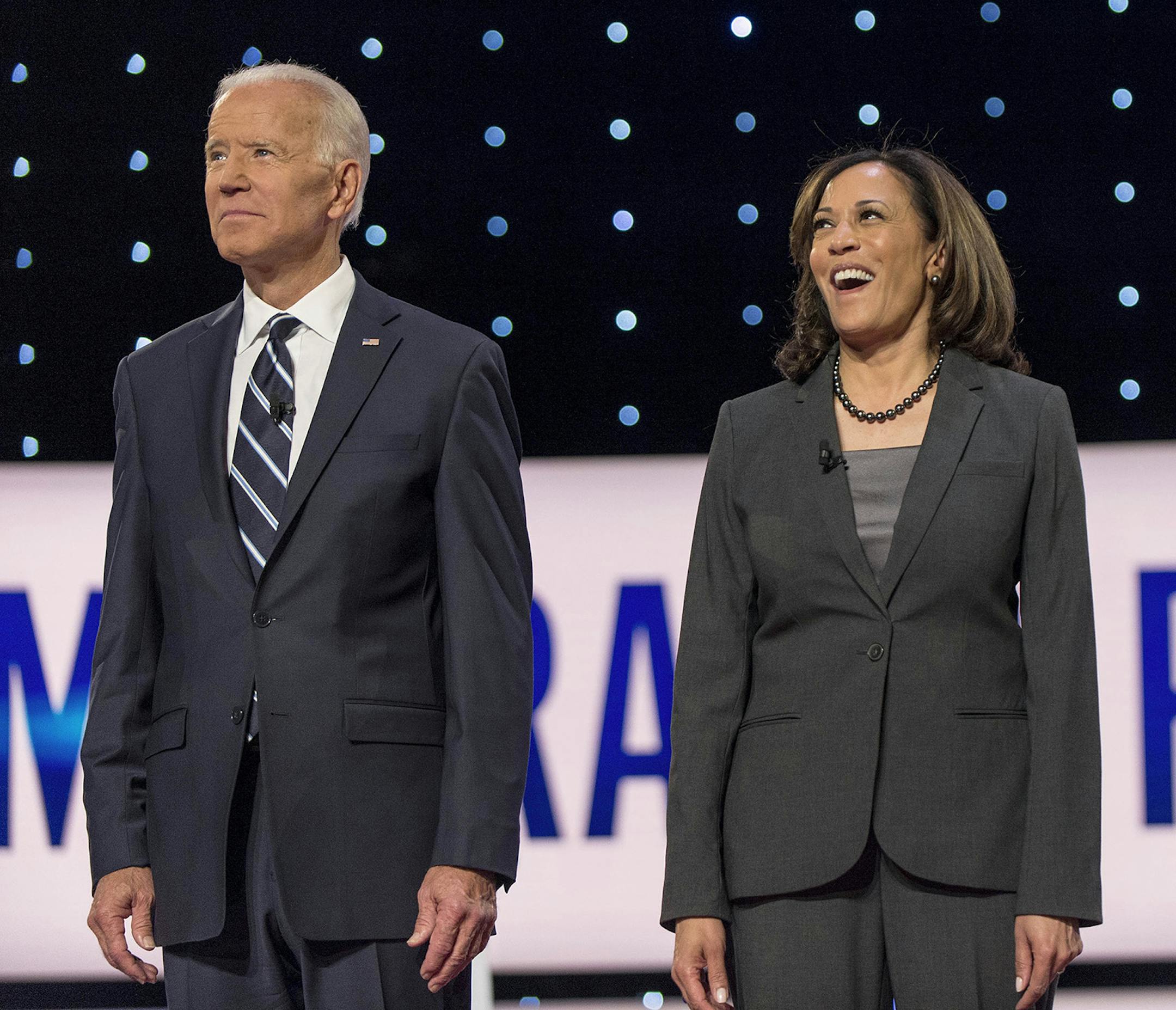 Joe Biden and Kamala Harris pose for the photo spray during a commercial break at the second of two Democratic Debates in Detroit hosted by CNN and sanctioned by the DNC. (Brian Cahn/Zuma Press/TNS) ORG XMIT: 1416309