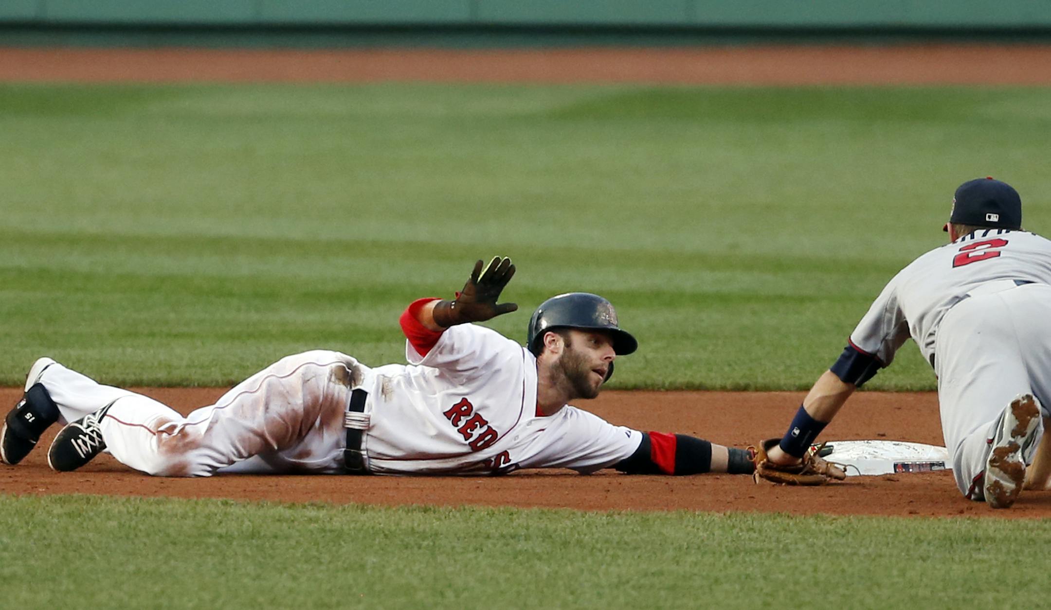 Boston Red Sox's Dustin Pedroia calls for time out after sliding in safely with a double as Minnesota Twins second baseman Brian Dozier fields the throw in during the first inning of a baseball game at Fenway Park in Boston, Tuesday, June 17, 2014. (AP Photo/Elise Amendola)