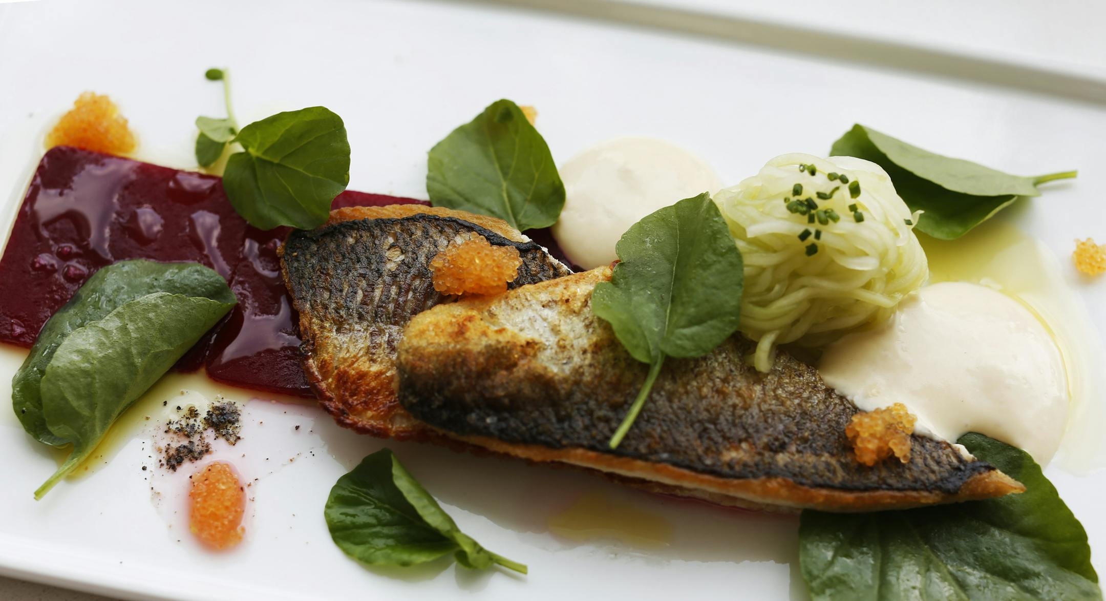 At Fika, the restaurant in the new wing of the American Swedish Institute in Minneapolis, a special includes the Lake Superior herring with beets, cucumber sald, quark foam, and watercress. This dish was created b y chef de cuisine Sam Miller .] rtsong-taatarii@startribune.com