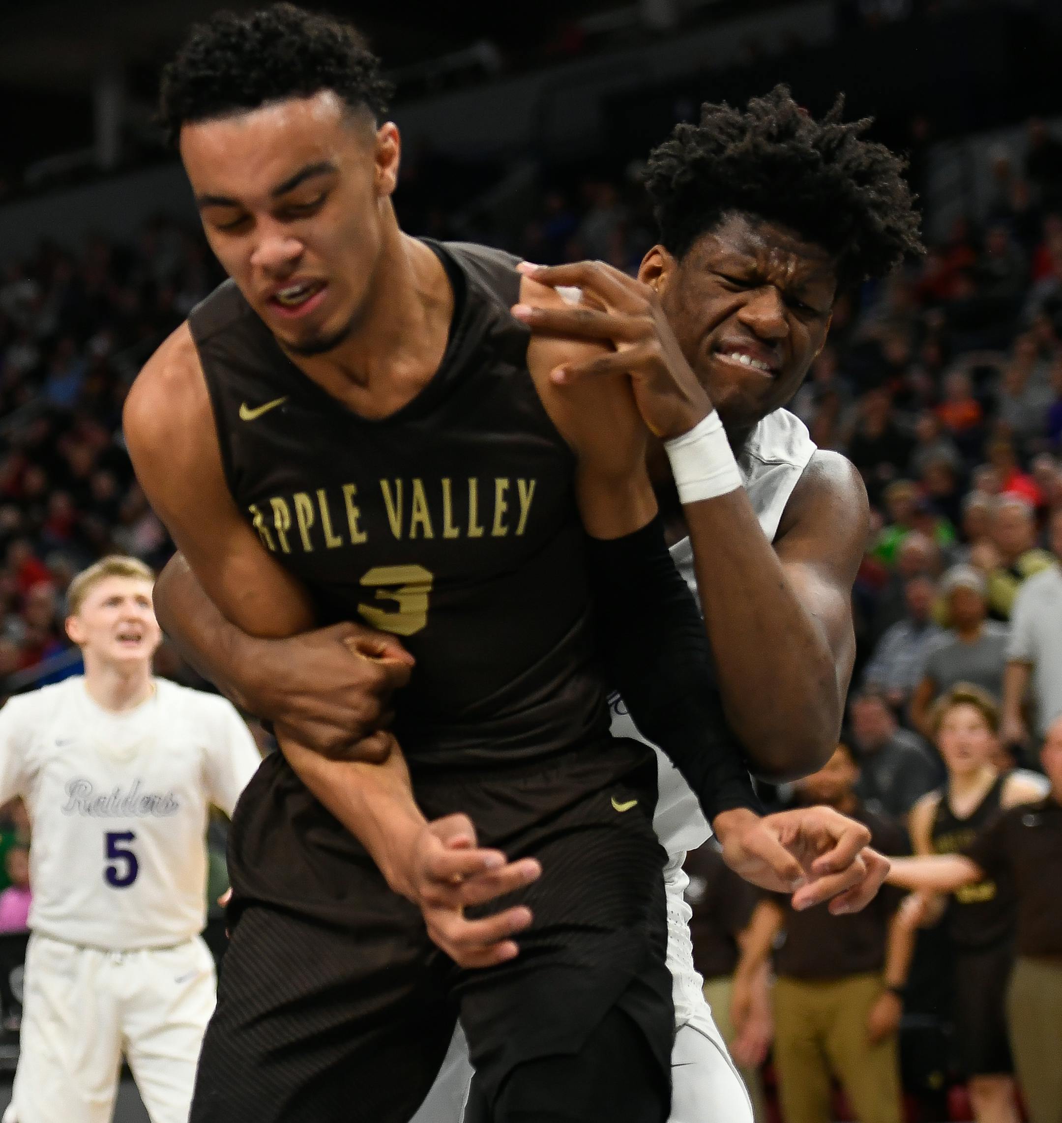 Cretin-Derham Hall forward Daniel Oturu (25) threw Apple Valley guard Tre Jones (3) to the court, resulting in a technical foul in the first half Saturday. ] AARON LAVINSKY ï aaron.lavinsky@startribune.com Apple Valley played Cretin-Derham Hall in a Class 4A boy's basketball championship game on Saturday, March 24, 2018 at Target Center in Minneapolis, Minn.