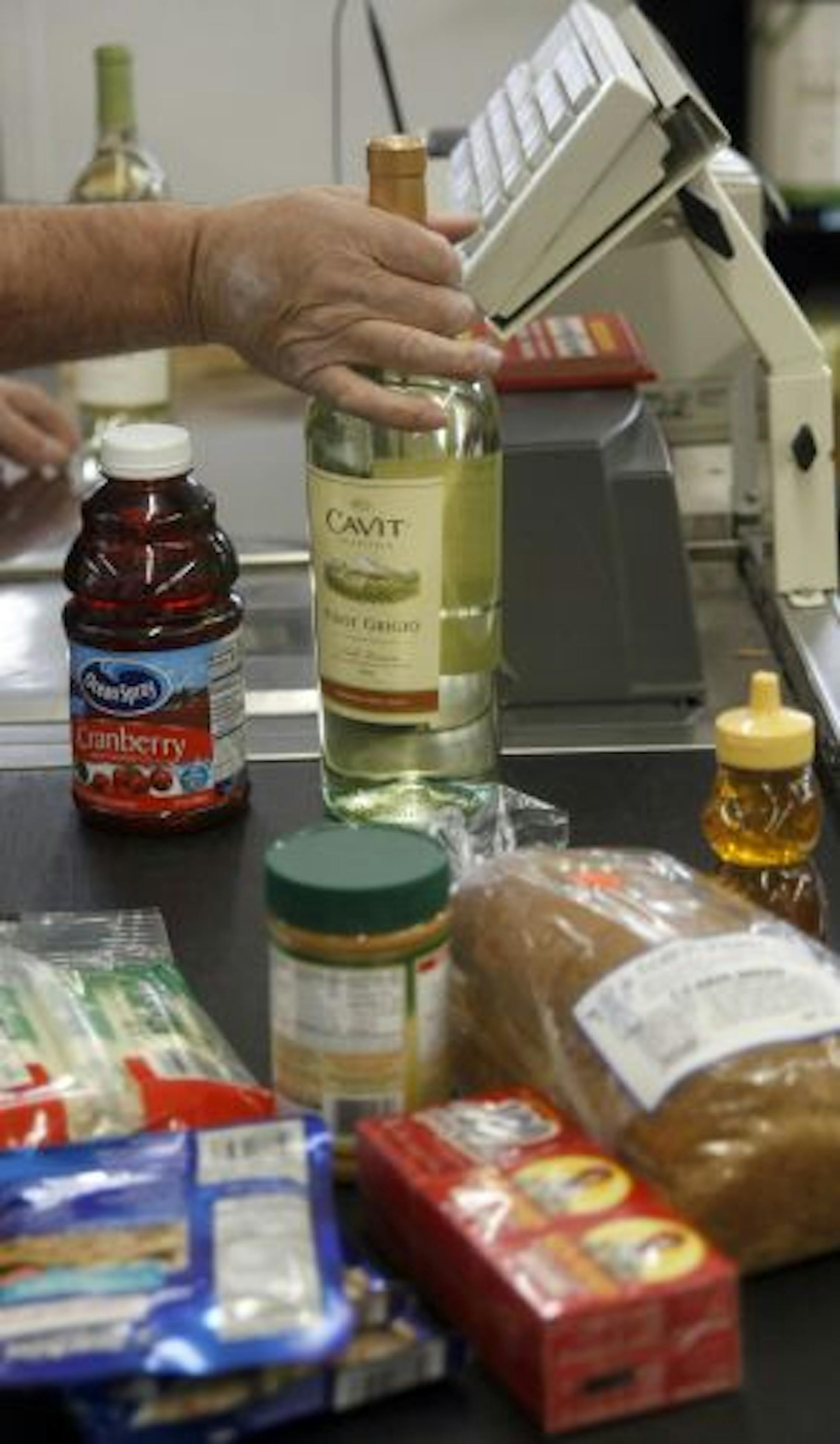 Sentryz Supermarket sells beer, wine and liquor in aisles adjacent to grocery items.
