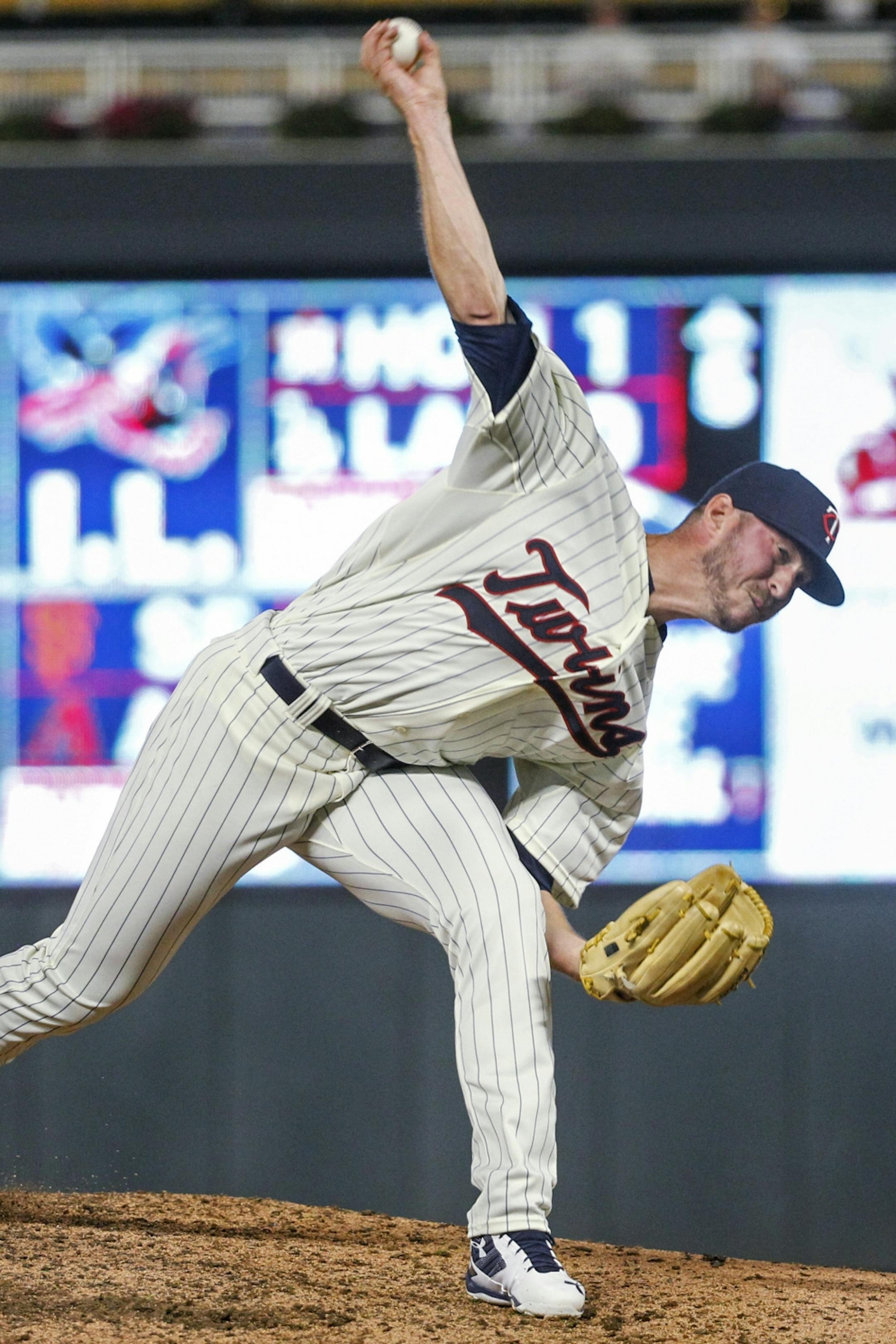 Minnesota Twins relief pitcher Oliver Drake throws to a Kansas City Royals batter during the ninth inning of a baseball game Saturday, Aug. 4, 2018, in Minneapolis. The Twins won 8-2. Drake pitched for his fifth team this season.