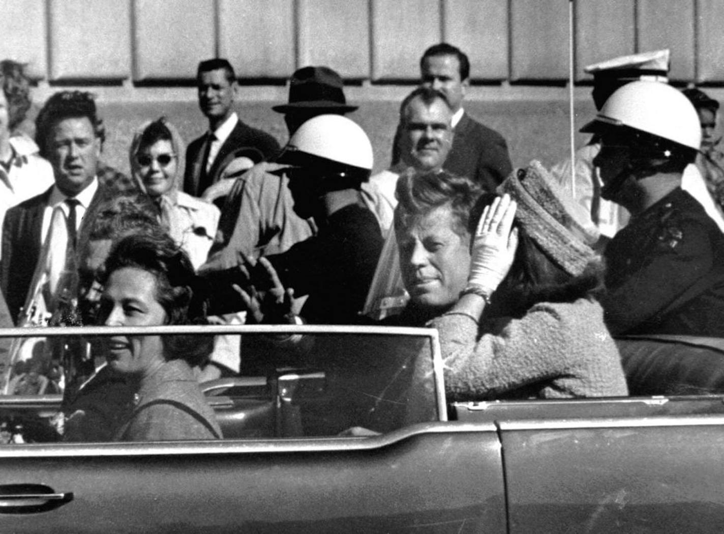 President John F. Kennedy is seen riding in motorcade approximately one minute before he was shot in Dallas, Texas on Nov. 22, 1963.