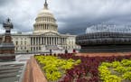 FILE- In this May 30, 2018, file photo the East Front of the U.S. Capitol in Washington is seen under stormy skies. The federal government piled up a 