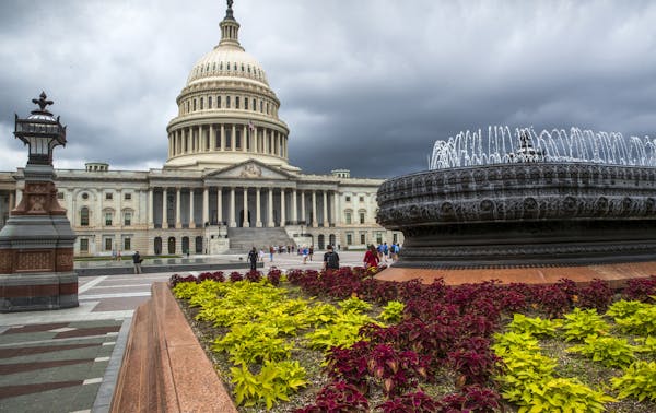 FILE- In this May 30, 2018, file photo the East Front of the U.S. Capitol in Washington is seen under stormy skies. The federal government piled up a 