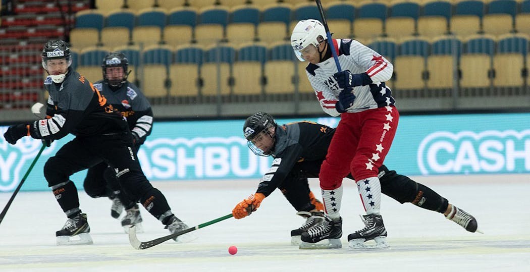 Bandy is fast like hockey, with differences: for one, it uses a ball instead of a puck. The U.S. team is shown vs. Germany in 2019.