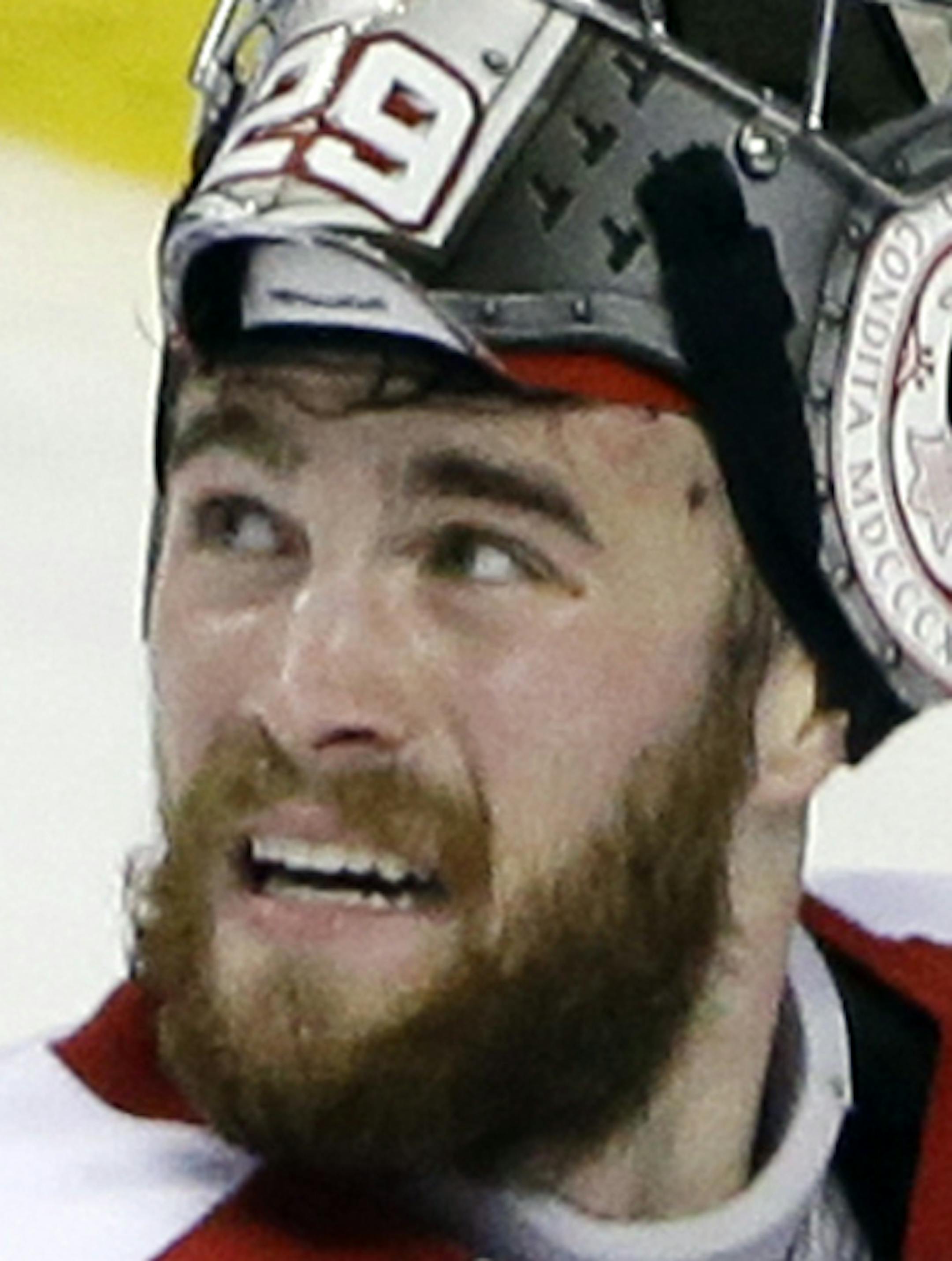 Boston University goalie Matt O'Connor looks up at the scoreboard after kicking in an own goal for Providence during the third period of the NCAA men's Frozen Four hockey championship game in Boston, Saturday, April 11, 2015. Providence won 4-3. (AP Photo/Elise Amendola)