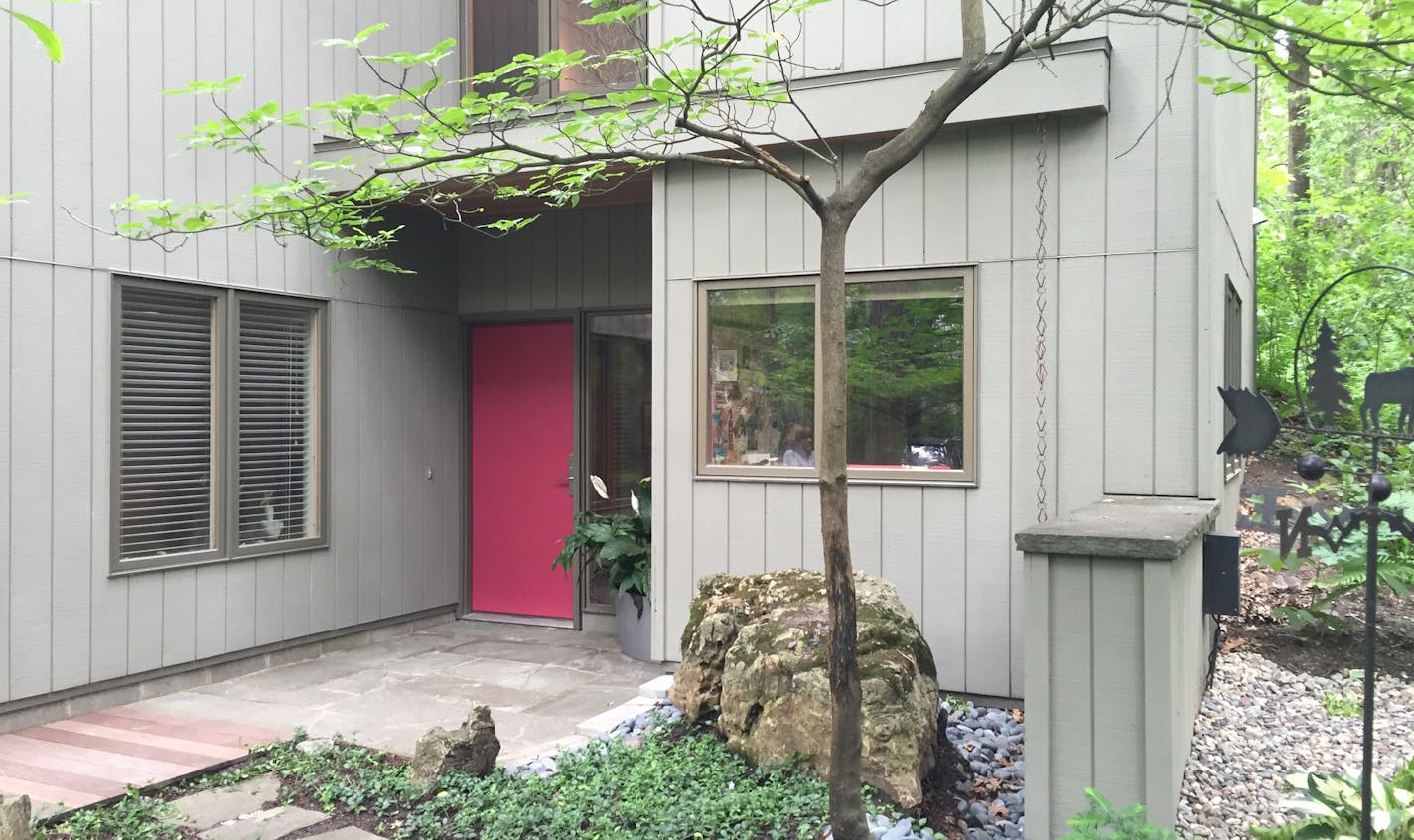 Rainwater used to run toward the front entry. New landscaping and an overhang redirect water.