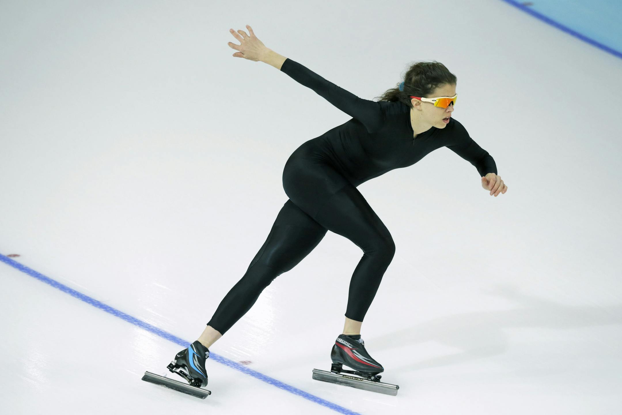 Maria Lamb of the U.S. skated in a black suit after changing suits during a training session at the Adler Arena Skating Center at the 2014 Winter Olympics.