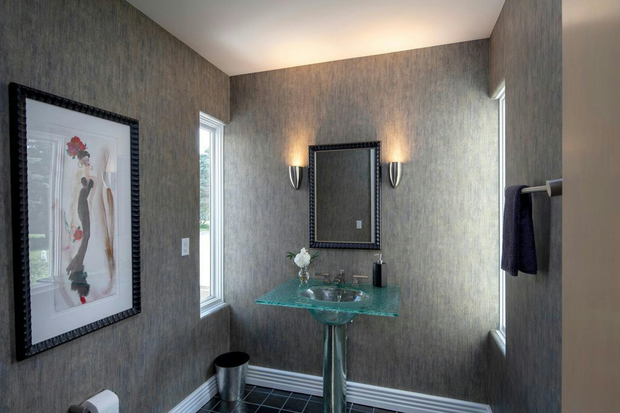 Bathroom with glass sink.